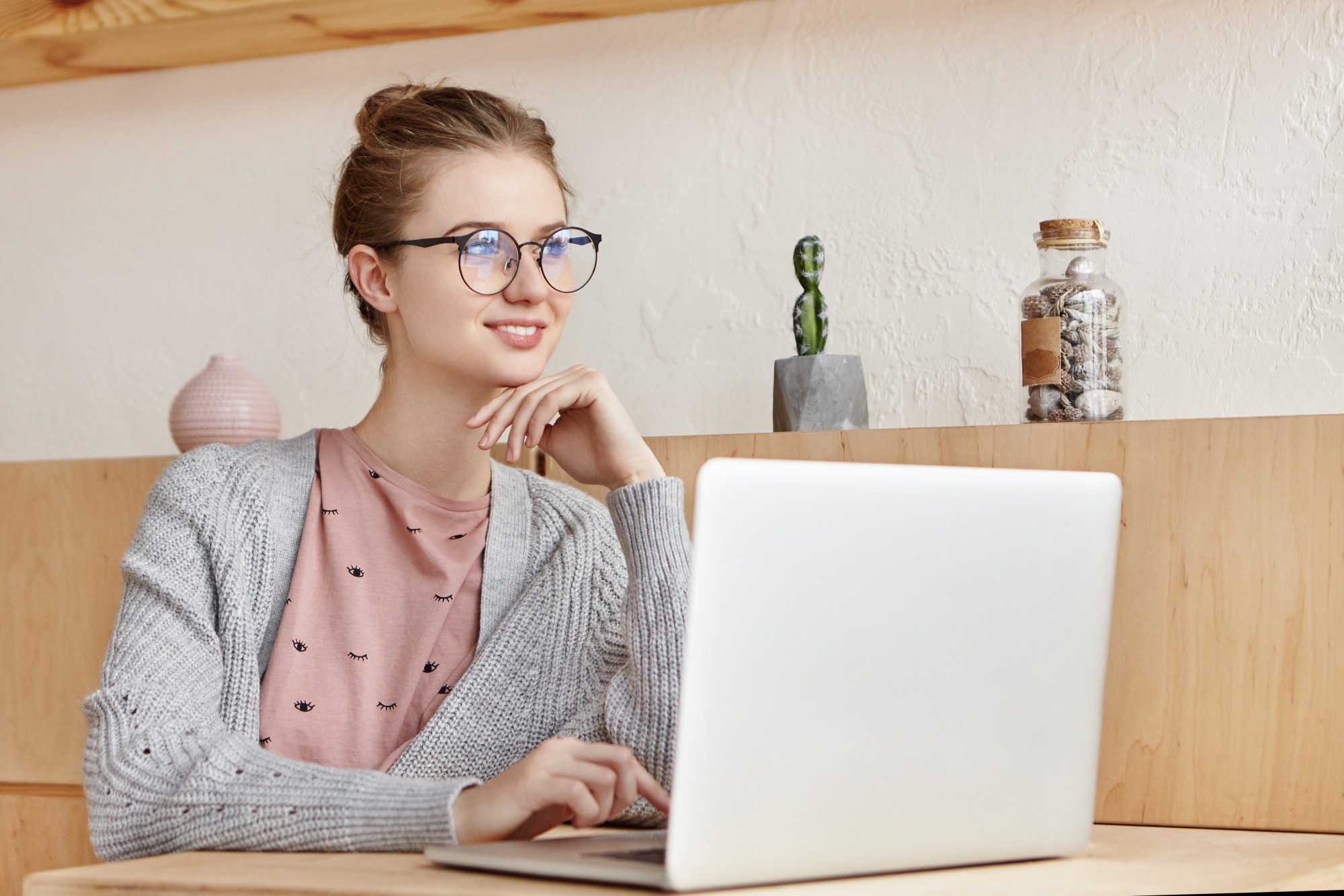 Virtual Marketing Associate working on laptop