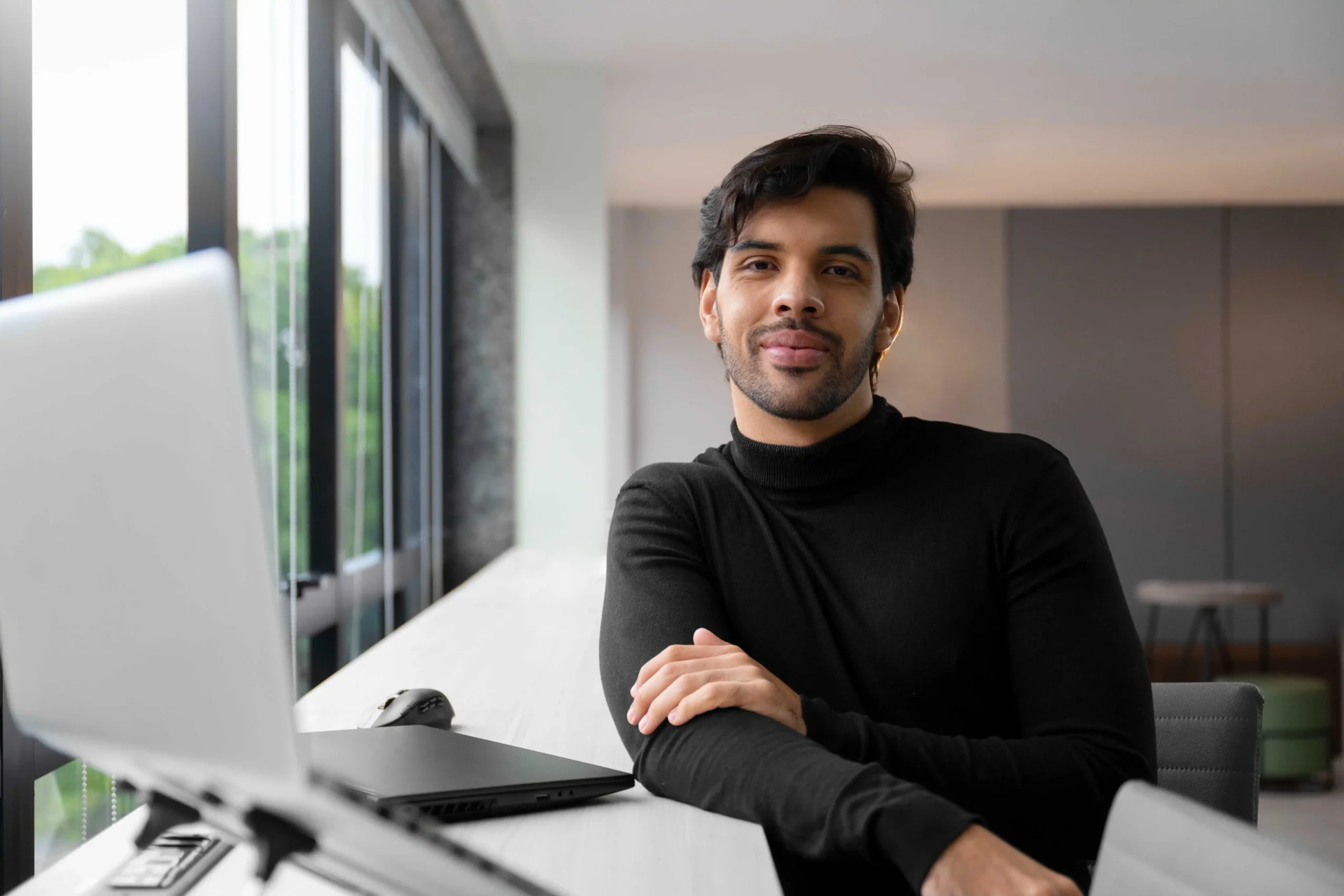 Web developer Associate working on laptop